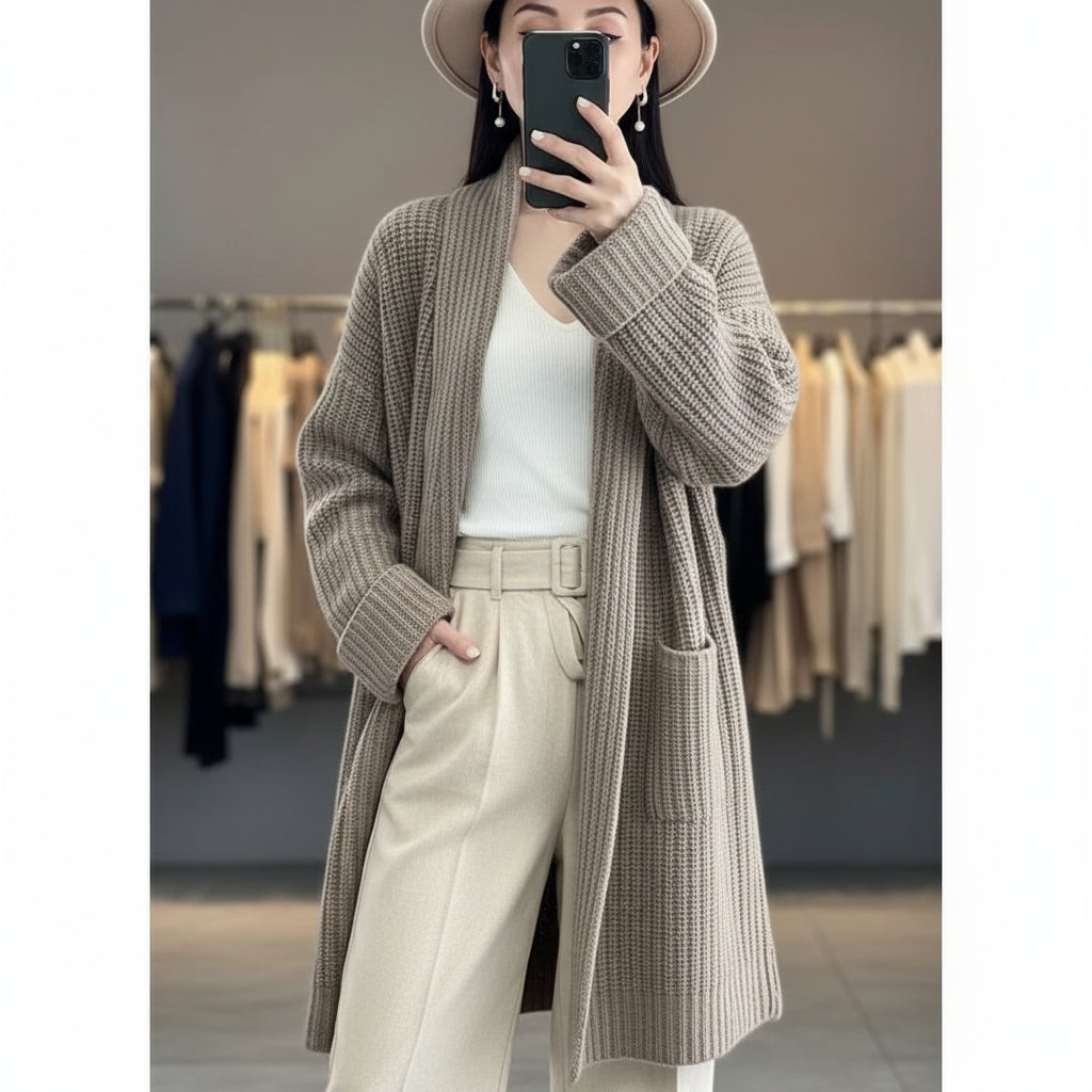 Person wearing a long, textured brown coat in a clothing store.